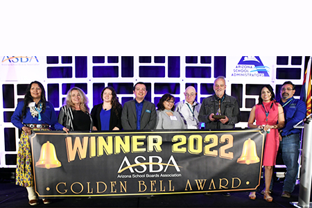 Group of CAVIT board members behind Winner 2022 ASBA banner
